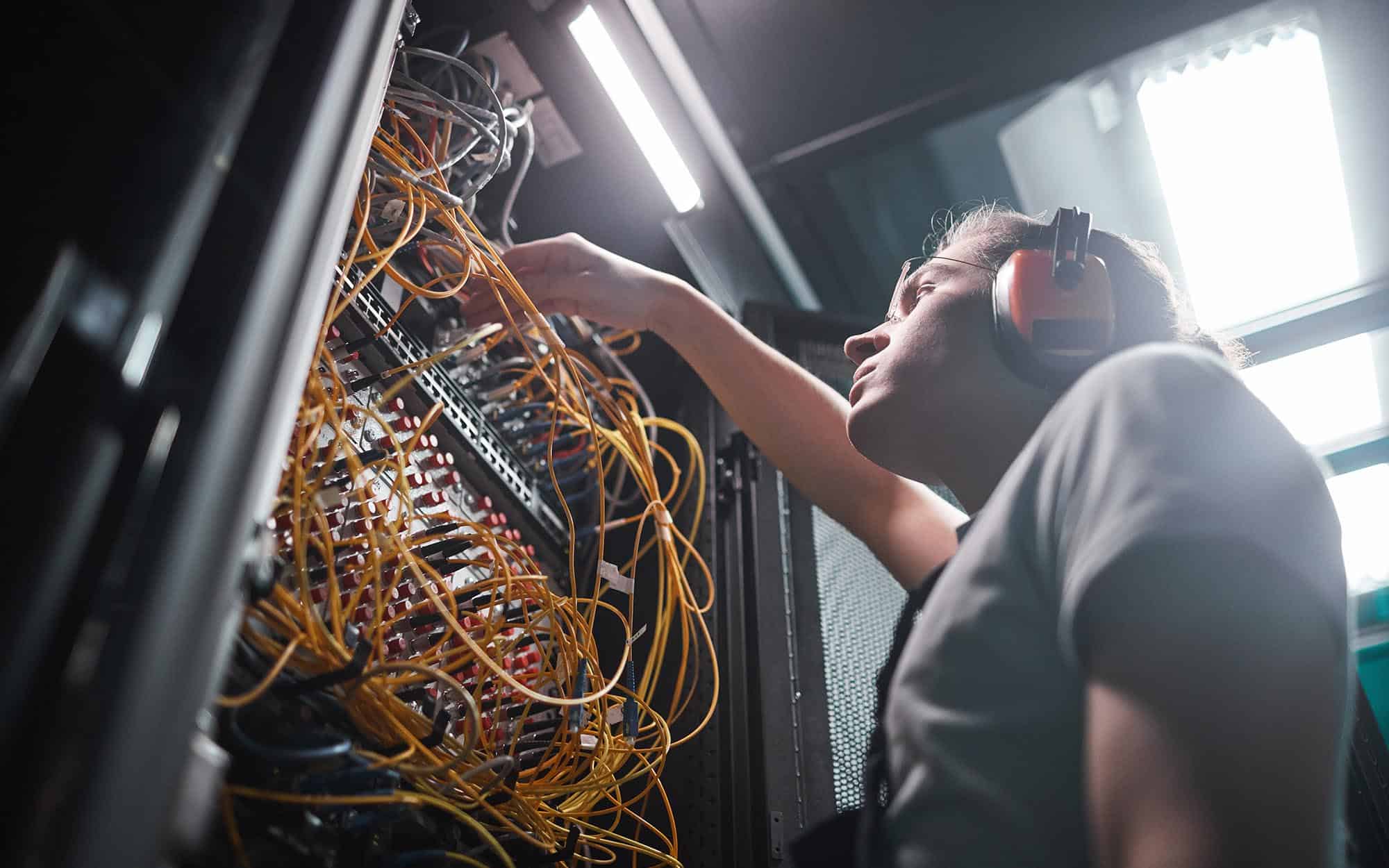 Person fixing data center in office